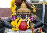 In Hindu mythology, Rahu is a snake that swallows the sun or the moon causing eclipses. He is depicted in art as a dragon with no body riding a chariot drawn by eight black horses. Rahu is one of the navagrahas (nine planets) in Vedic astrology. The Rahu kala (time of day under the influence of Rahu) is considered inauspicious.<br/><br/>

According to legend, during the Samudra manthan, the asura Rahu drank some of the divine nectar. But before the nectar could pass his throat, Mohini (the female avatar of Vishnu) cut off his head. The head, however, remained immortal. It is believed that this immortal head occasionally swallows the sun or the moon, causing eclipses. Then, the sun or moon passes through the opening at the neck, ending the eclipse.<br/><br/>

Wat Traimit is a Thai Buddhist temple found in the Chinatown area of Bangkok. It is chiefly known for housing the world's largest solid gold Buddha figure, the Phra Phuttha Maha Suwan Patimakon. The image is also the largest solid gold statue of any kind in the world.